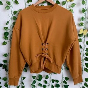 Women’s yellow corset style sweater